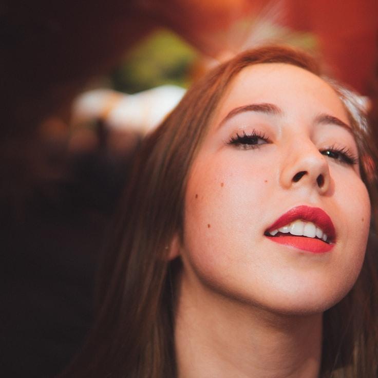 Kaveri Mehta, Lead Design Curator at Quiet Morning Harbor, reviewing corporate floral arrangements